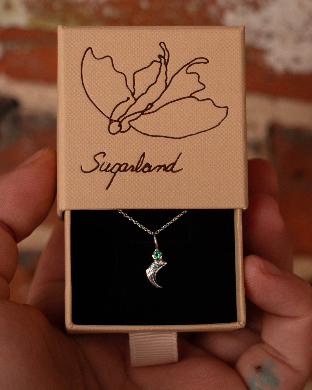 GEMSTONE CLAW PENDANT